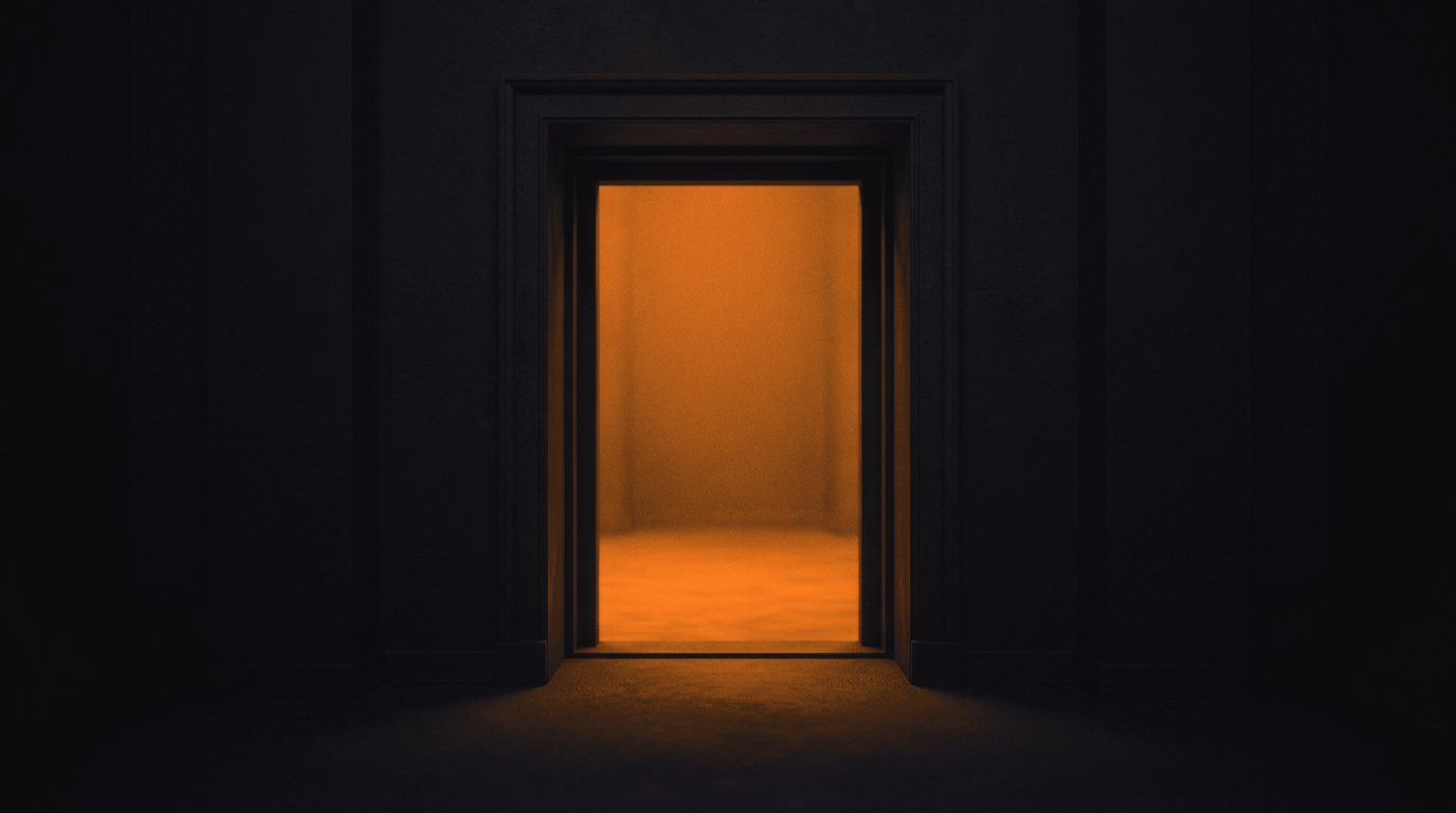 A lit doorway seen from a dark room